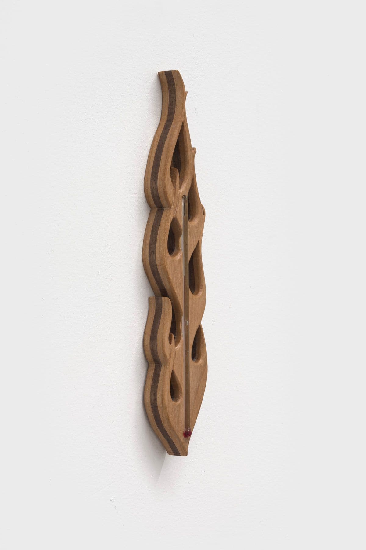 Rebecca R. Peel. sorcery/forgery i, 2023. Reclaimed walnut, red oak, glass thermometer. 10 x 4 x 1 inches.