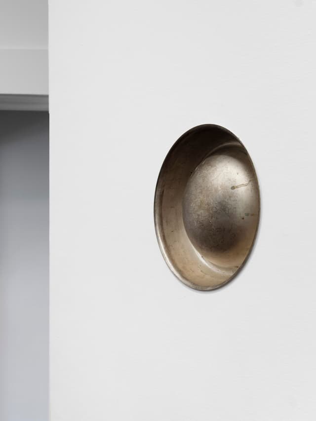 Winona Sloane Odette. Untitled (Detail), 2023. Silver plated dog bowl, phonograph horn, drywall. Dimensions variable.