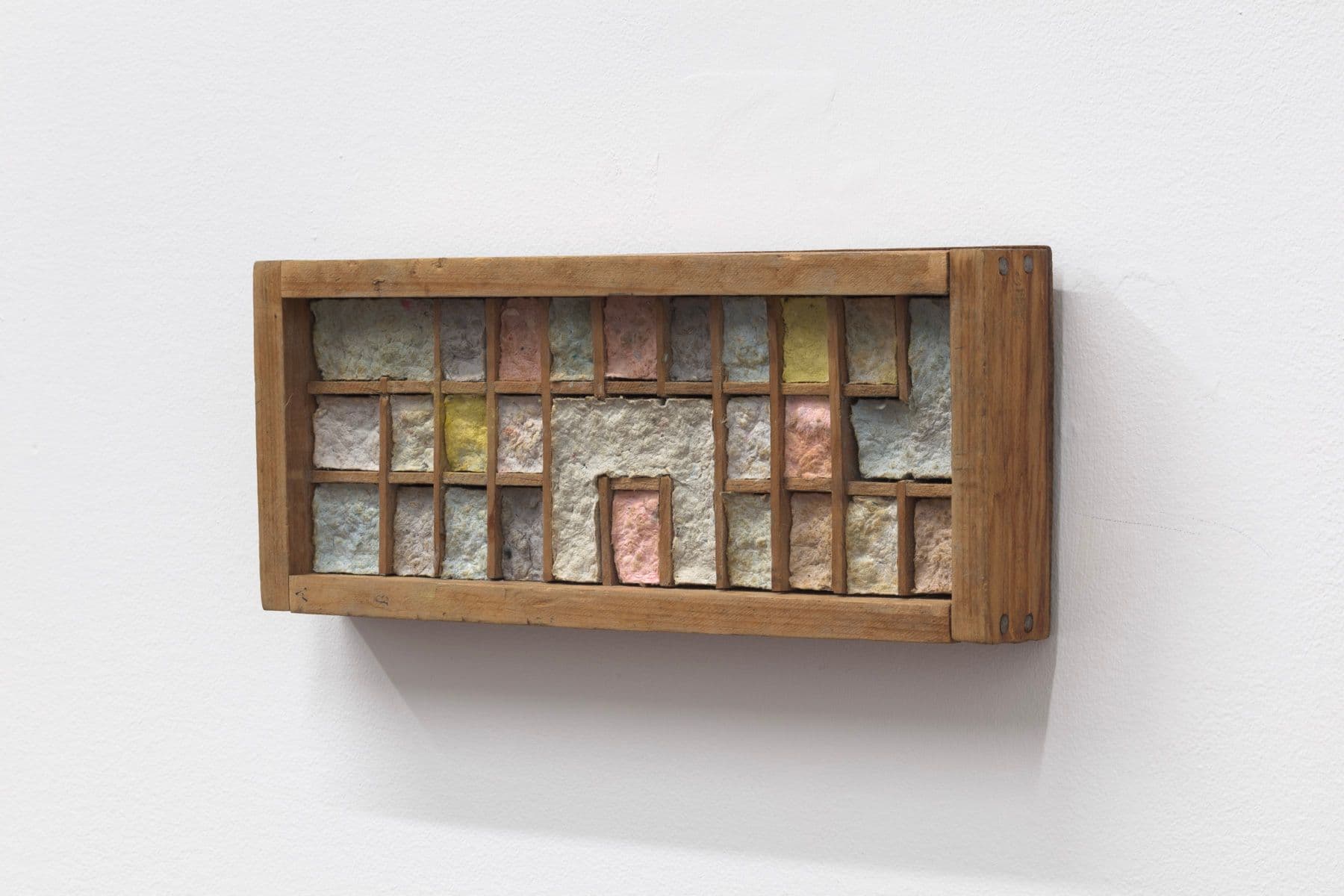 Bronson Smillie. Debris Flow Bungalow, 2022. Modified wooden letter press case, paper pulp. 4 x 9.5 x 1.5 inches.