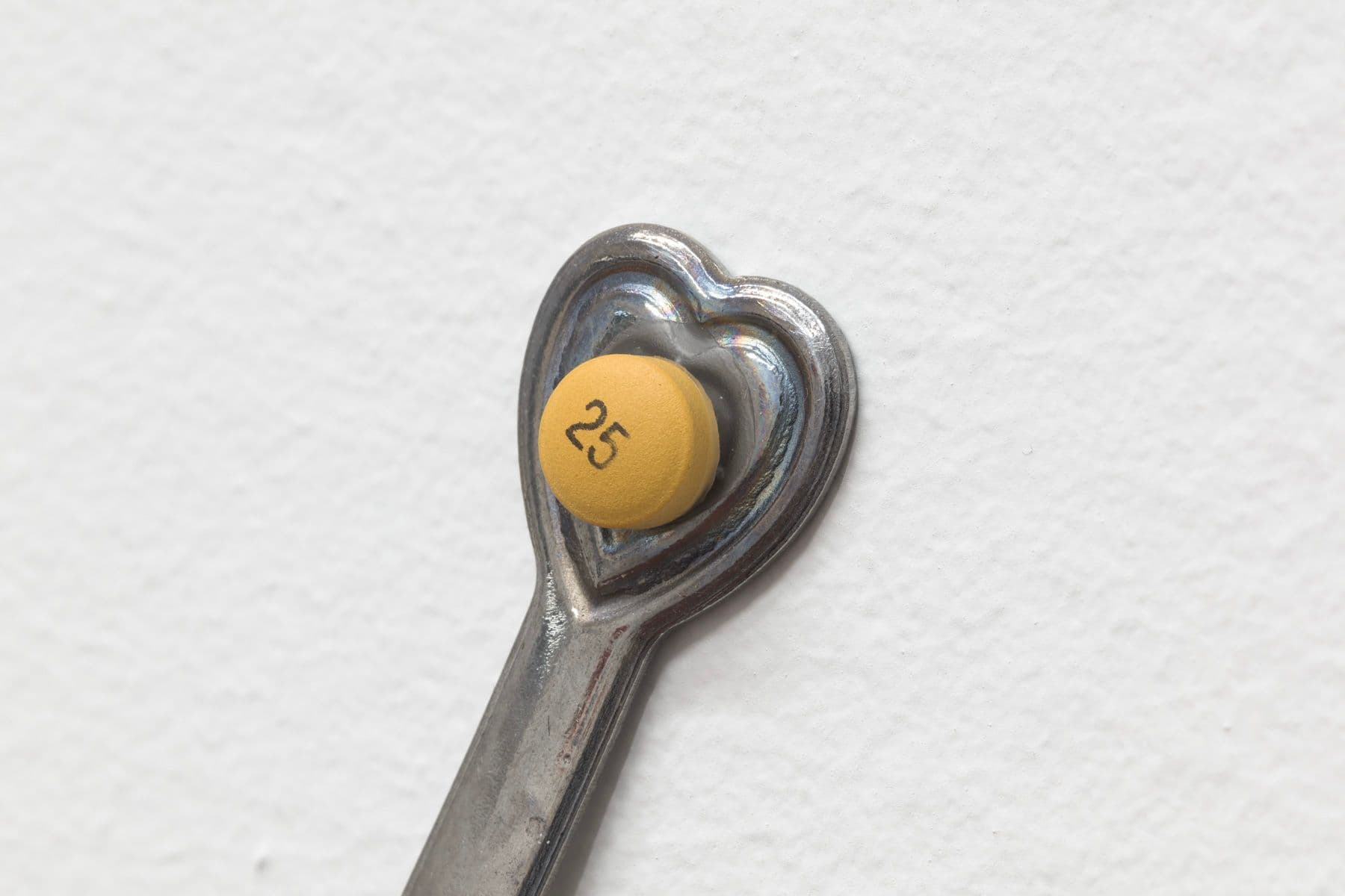 Sharona Franklin. Compassion Crip Clock (Detail), 2021. Spoons, metal alloy, expired pharmaceuticals. 11.5 x 11.5 inches.