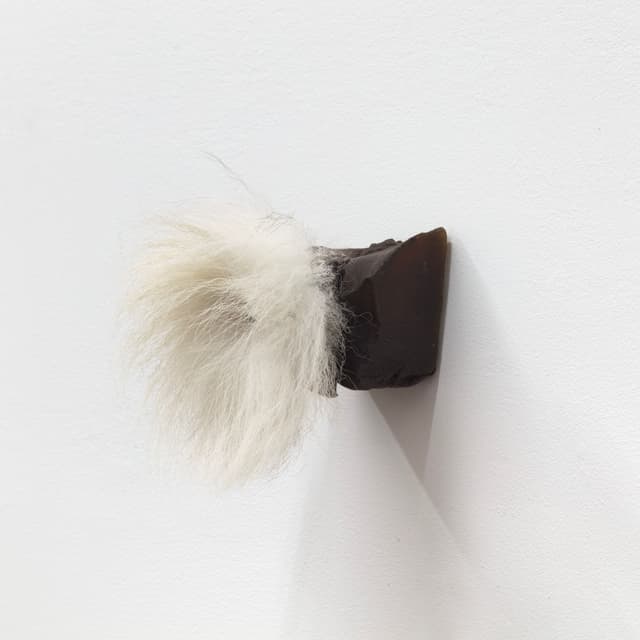 Winona Sloane Odette. Untitled, 2022. Beeswax, pigment, eyeshadow, found bell, fox tail, tack. 4 x 3 x 5 inches.