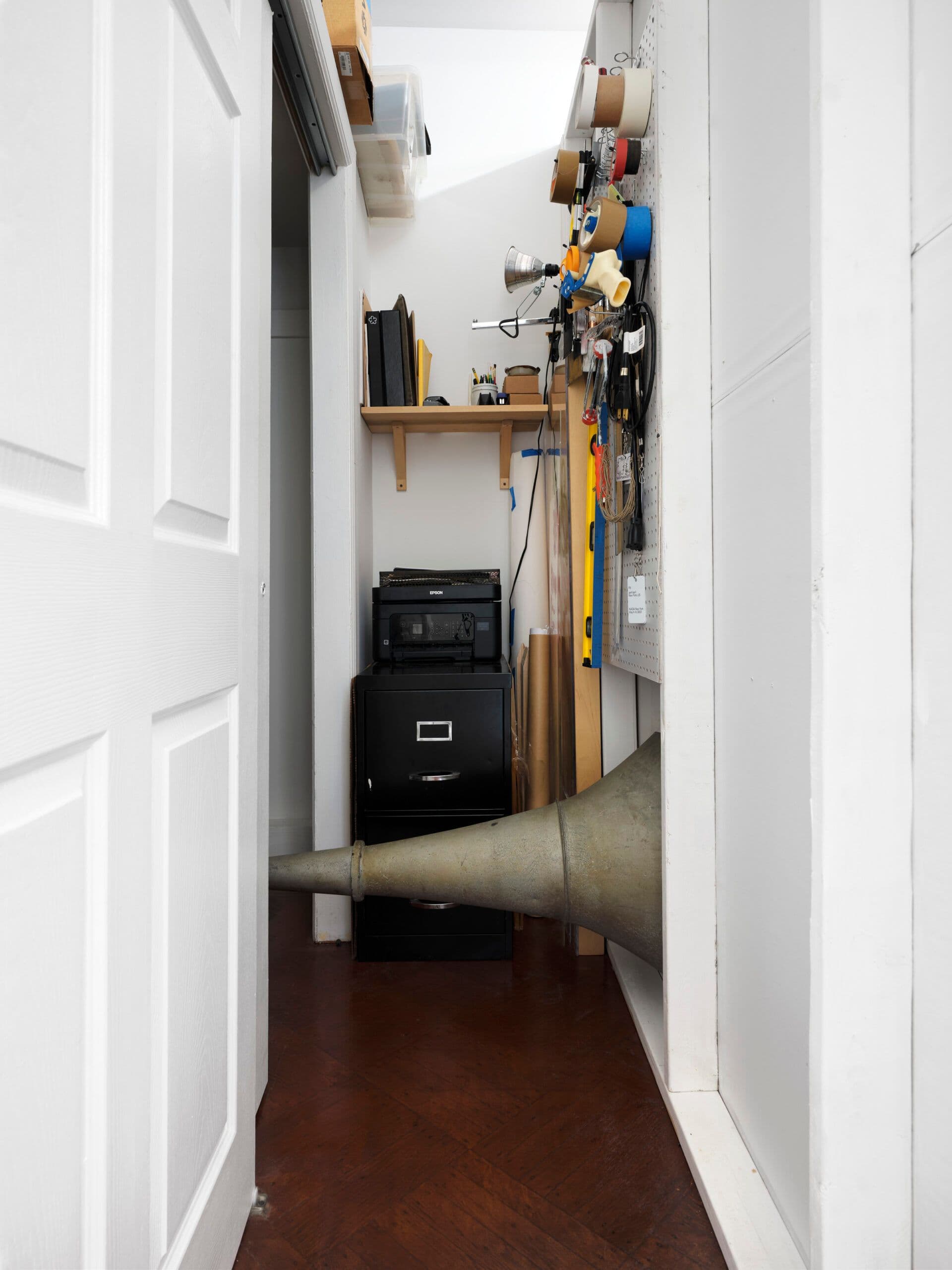 Winona Sloane Odette. Untitled (Detail), 2023. Silver plated dog bowl, phonograph horn, drywall. Dimensions variable.