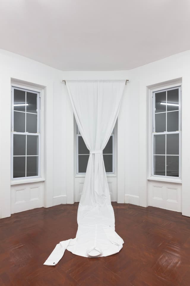 Bea Fremderman. Untitled, 2021. Cotton, buttons, cufflinks, curtain rod. Dimensions variable.