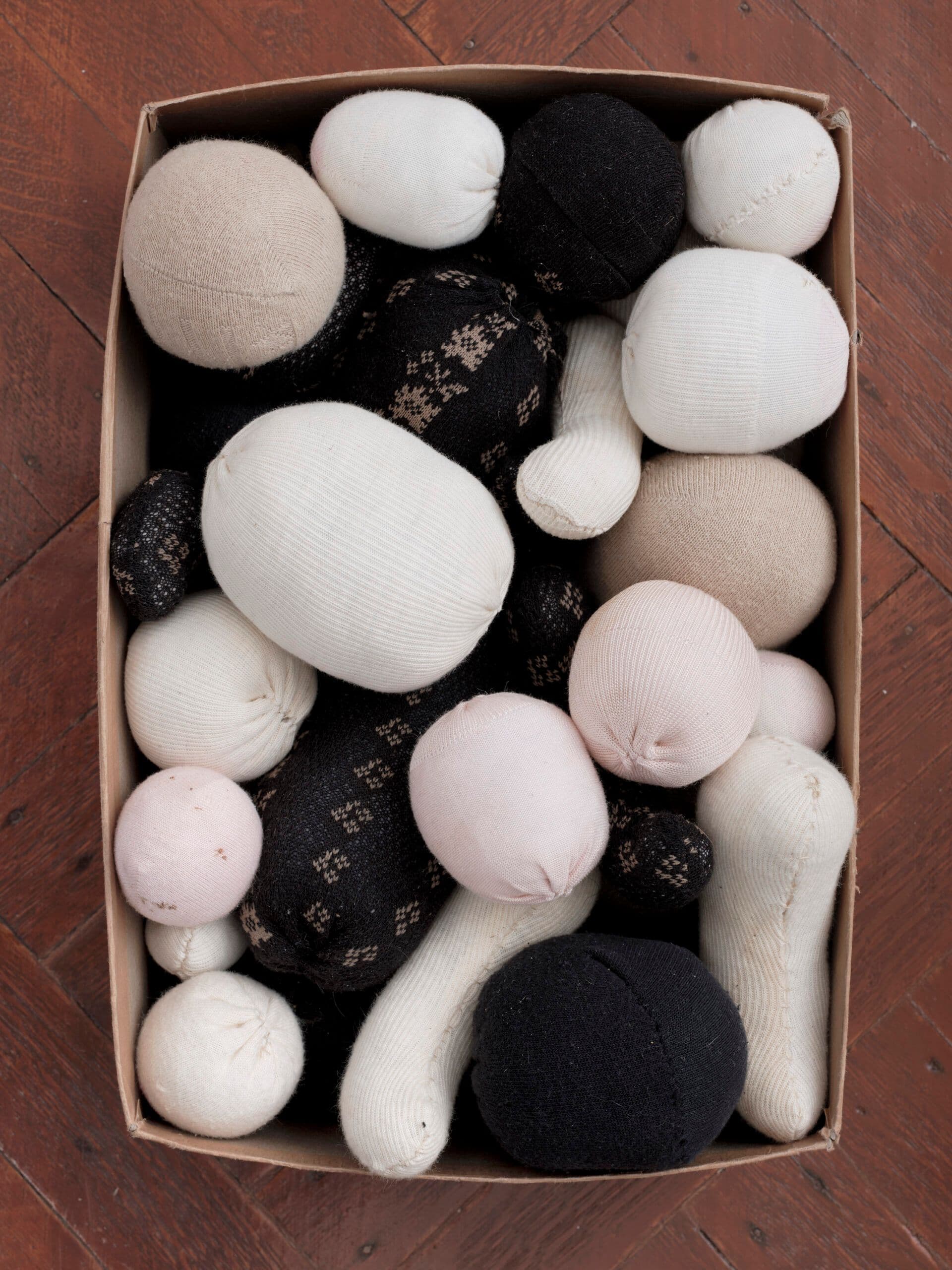 Winona Sloane Odette. Untitled (Detail), 2023. Trimmings/notions box, socks, cotton/poly batting. 12.5 x 8 x 5 inches.