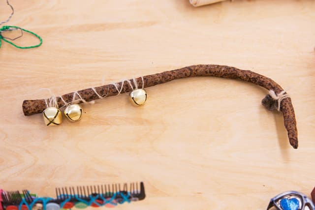 Alix Van Der Donckt-Ferrand. Untitled, 2022. Rusted metal, alpaca hair (yarn), bells, deerhide used to hair tie and then tied to dog pendant, button. 11 x 5 x 0.5 inches.