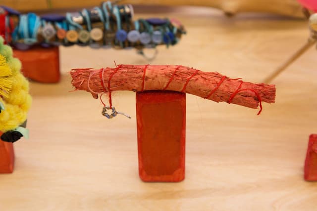 Alix Van Der Donckt-Ferrand. Untitled, 2023. Dog chewed stick, belly button piercing, wood, fabric dye. 2.5 x 6.5 x 1 inches.