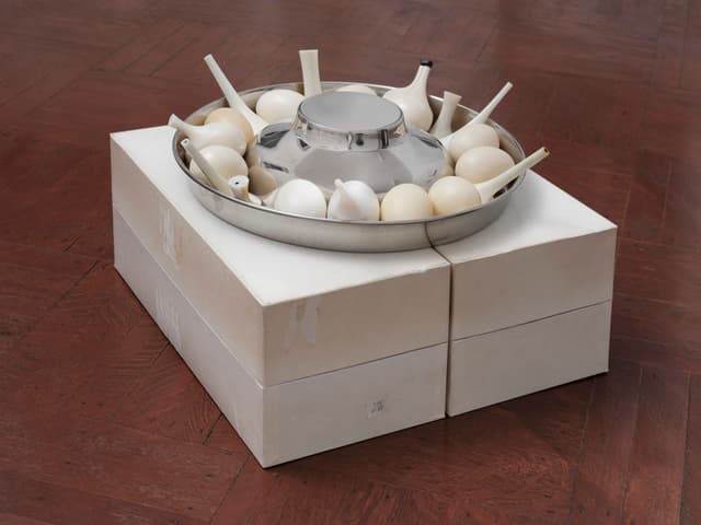 Winona Sloane Odette. Untitled, 2023. Trimmings/notions boxes, stainless steel slow feed dog bowl, tree sap, wax, corn starch, pigment, high heel components. 16.5 x 17 x 10.5 inches.