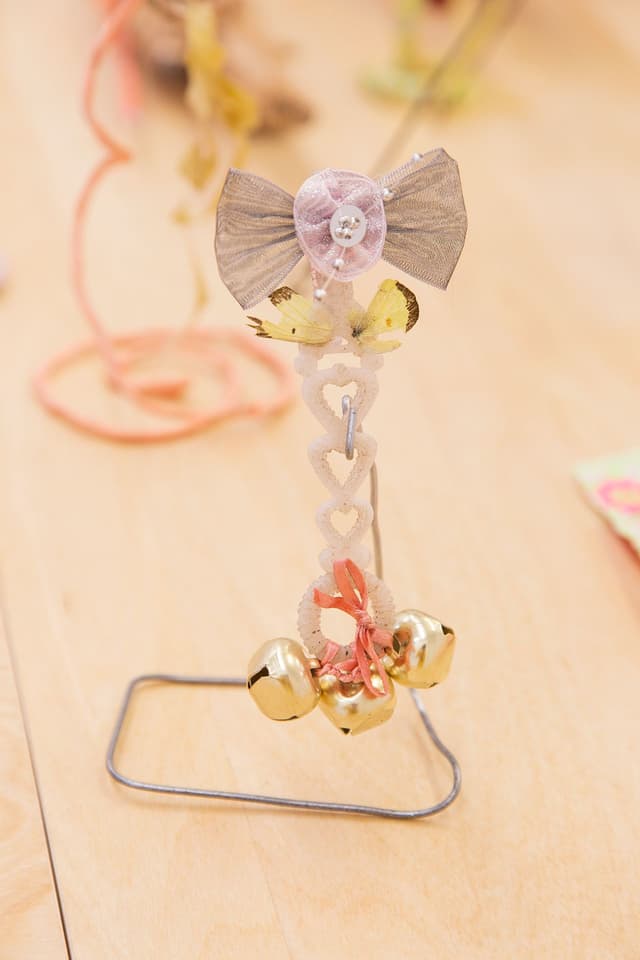 Alix Van Der Donckt-Ferrand. Untitled, 2023. Bubble maker, yellow sulphur butterfly,  bells, ribbons. 6.5 x 4 x 2.5 inches.