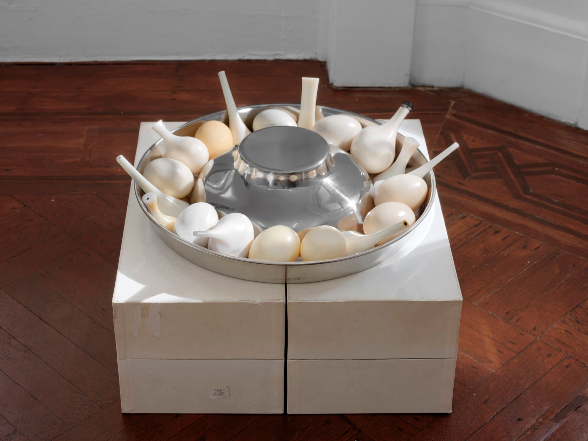 Winona Sloane Odette. Untitled, 2023. Trimmings/notions boxes, stainless steel slow feed dog bowl, tree sap, wax, corn starch, pigment, high heel components. 16.5 x 17 x 10.5 inches.