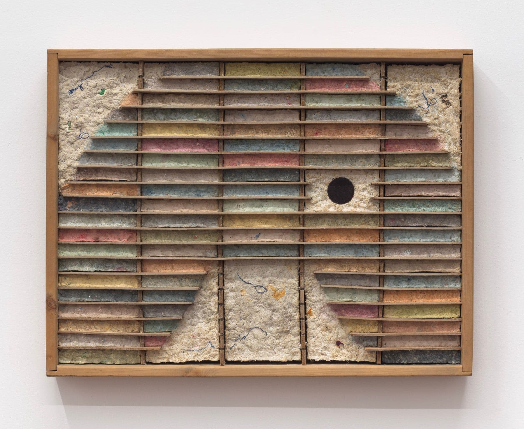 Bronson Smillie. Debris Flow Hotel, 2023. Modified cassette storage case, paper pulp, bar rag, postage stamp, felt pad. 18.5 x 24 x 3 inches