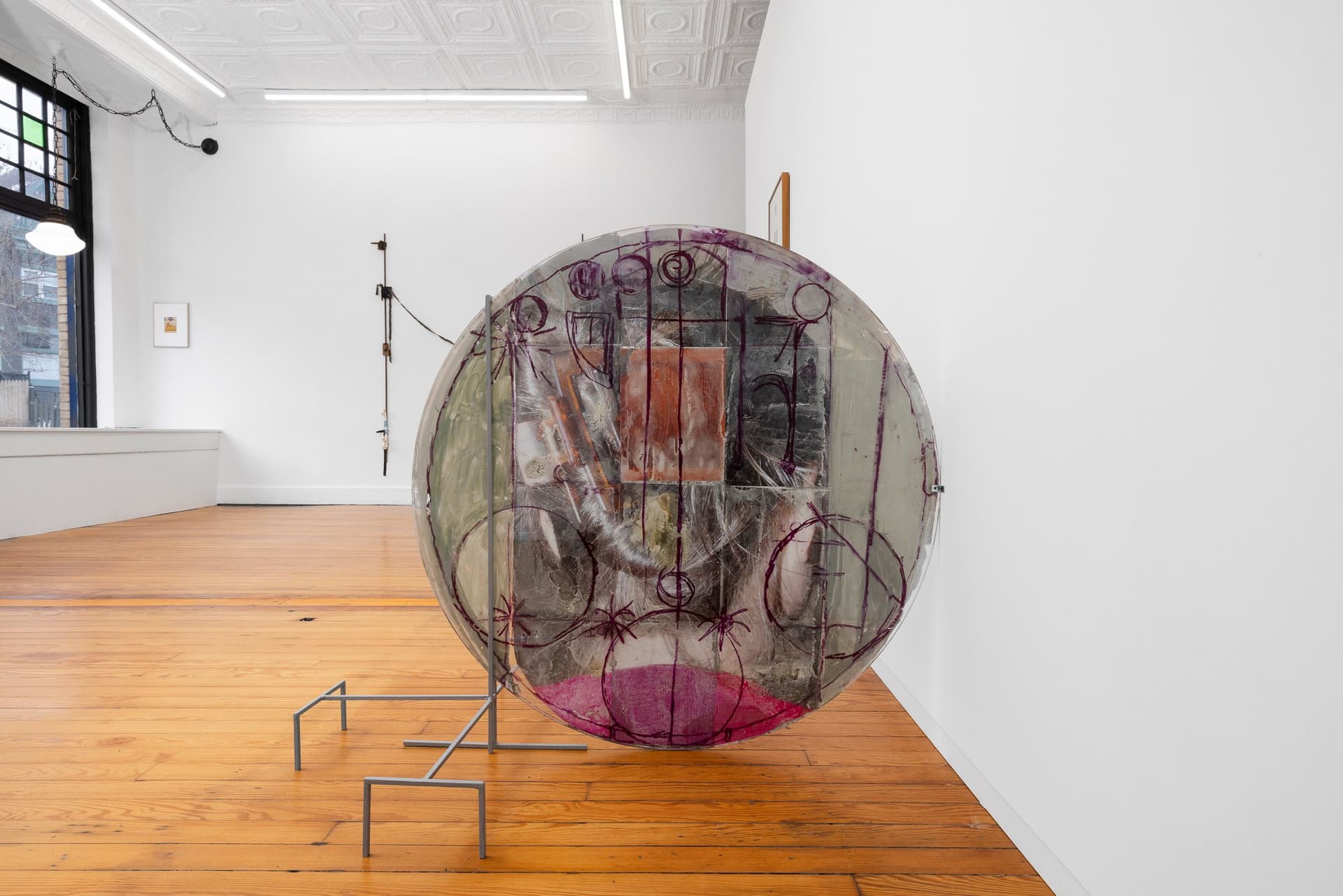 Marisa Kriangwiwat Holmes. Heads - Coin, 2024. Tiled inkjet glossy prints, oil pastel, rice and wheat paste on found glass, iron. 40 × 48 × 27 inches.