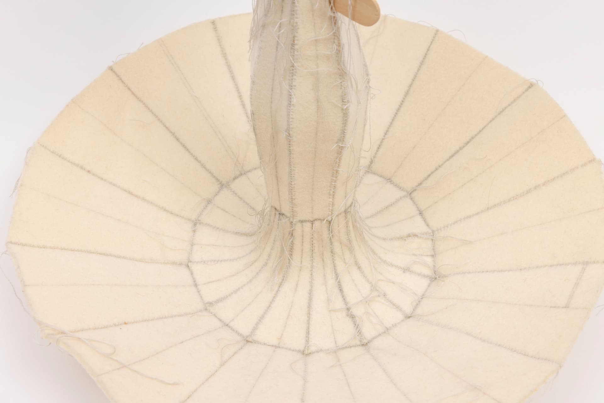 Cyrilla Mozenter. More saints seen 30 (Detail), 2005. Pencil on industrial wool felt hand stitched with silk thread and wooden ice cream spoon. 12.75 × 13 × 13 inches.