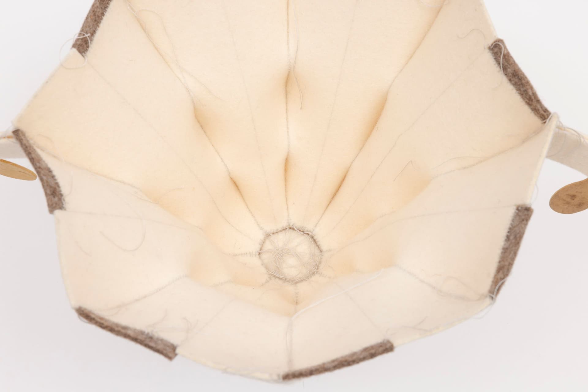 Cyrilla Mozenter. More saints seen 29 (Detail), 2005. Pencil on industrial wool felt hand stitched with silk thread and wooden ice cream spoons. 8.5 × 15.5 × 10.75 inches.