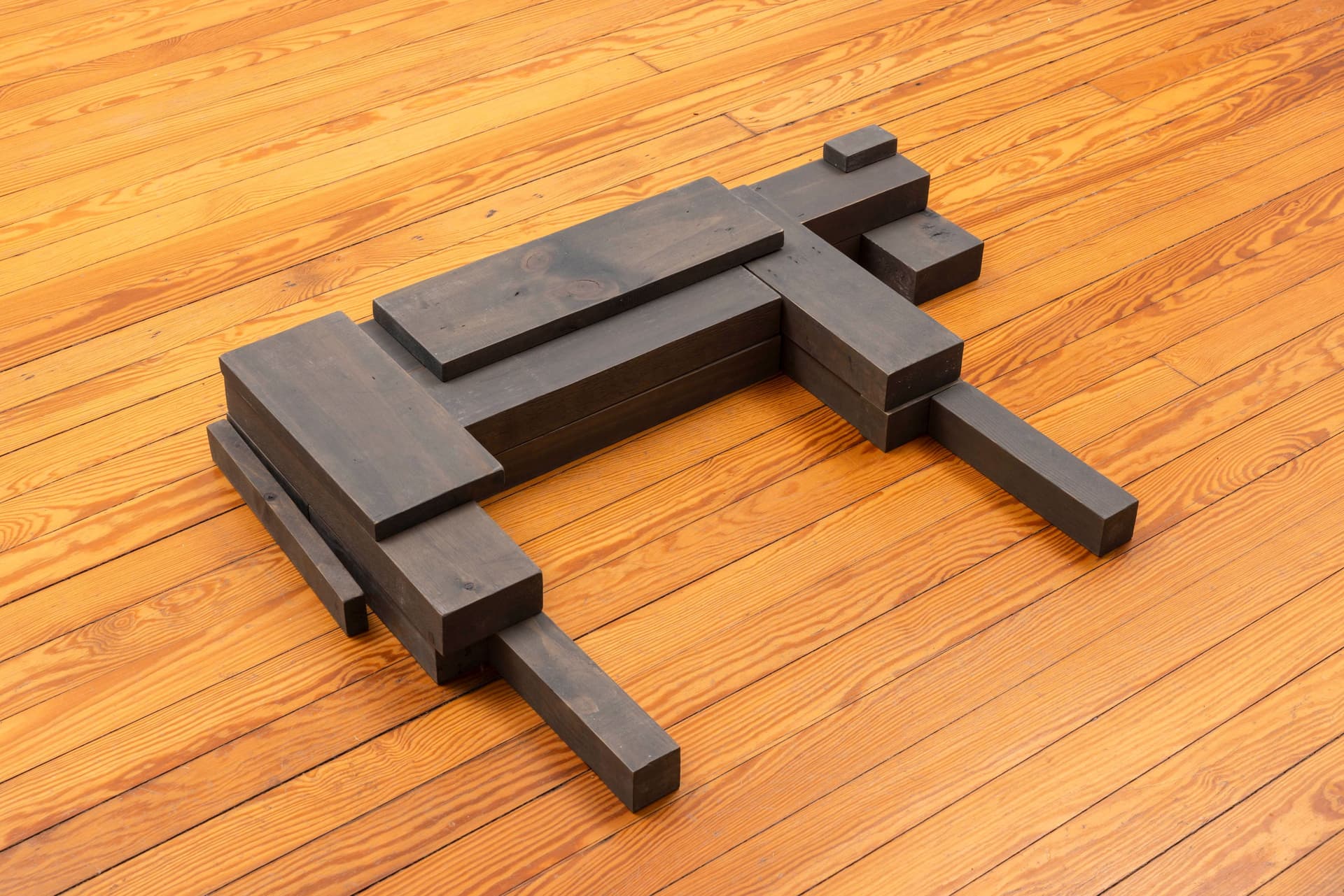 Lai Yu Tong. Dog (Greywash), 2025. Emulsion paint on pine wood. 4 3/4 × 31 1/2 × 23 1/2 inches. Courtesy the artist and ShanghART, Singapore.