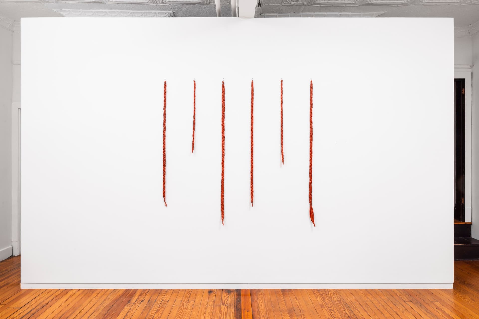 Faye HeavyShield. <i>gravity & ascension</i>, 2026. Acrylic and gesso on paper, wire. 60 × 61 1/2 inches. Dimensions variable.