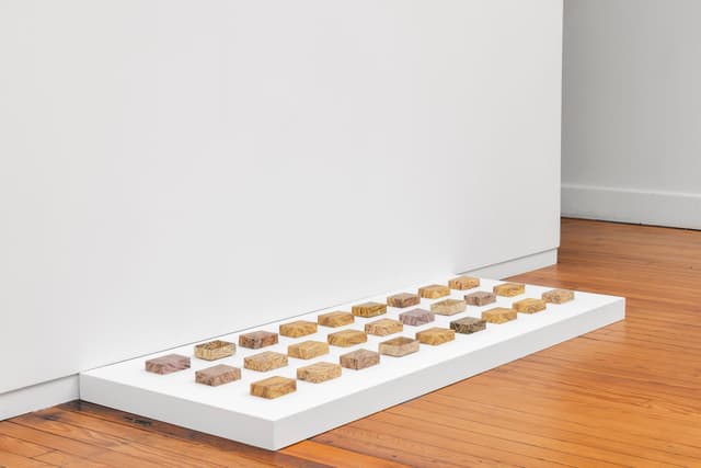 Faye HeavyShield. <i>real/i/ty</i>, 2025. Digital prints on paper, dirt. Dimensions variable.