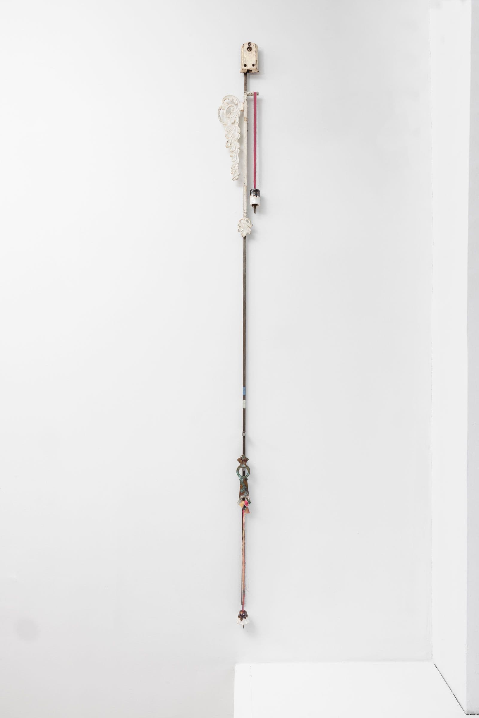 Marisa Kriangwiwat Holmes. Staff, 2024. Iron, ceramic, keys, metal locks, enamel paint, hand-dyed fabric. 77 × 5.5 inches.