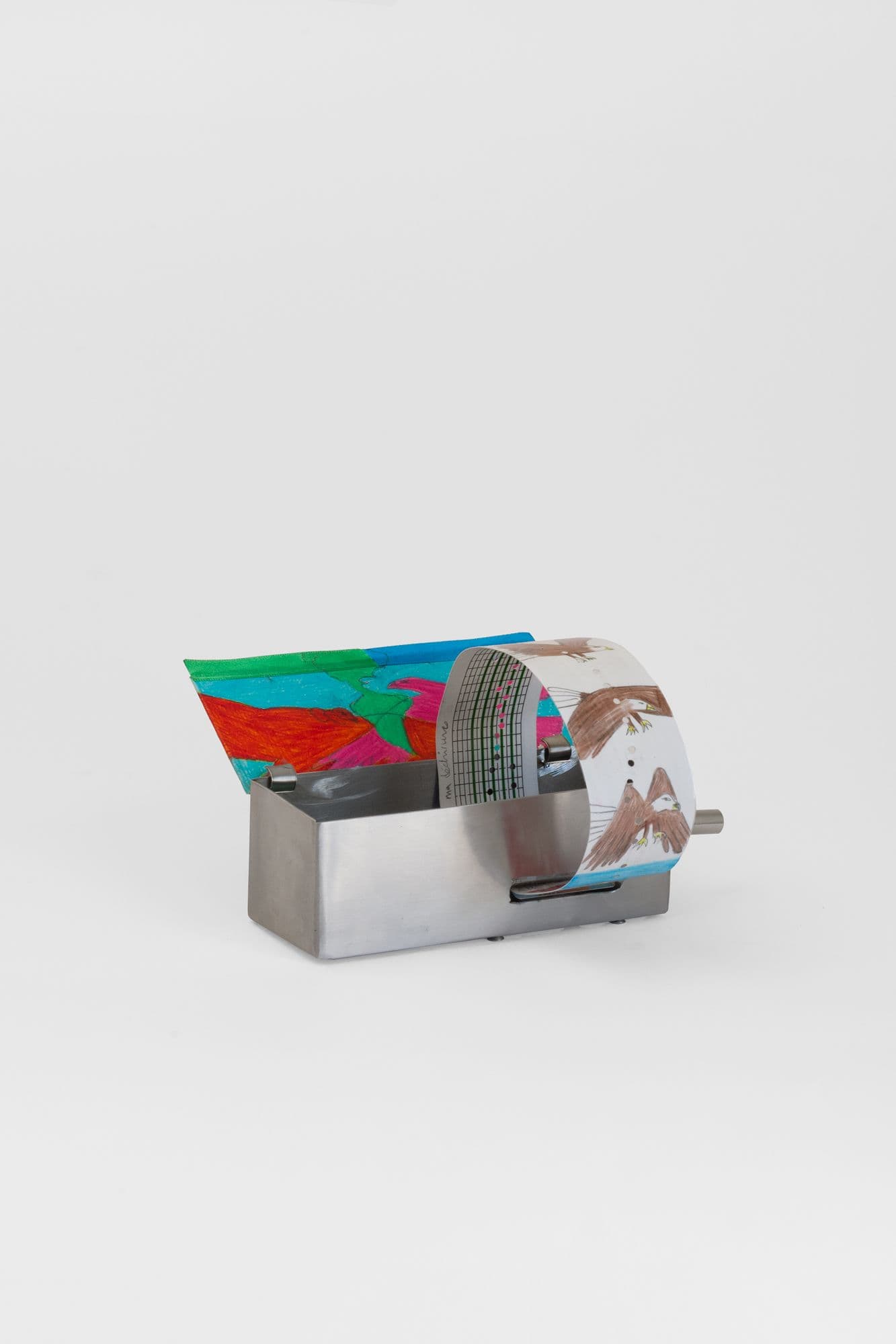Alix Van Der Donckt-Ferrand. Eagle and Condor Prophecy, 2025. Color pencil and graphite on paper, ribbons, steel music box. 5.5 x 2.25 x 2 inches.