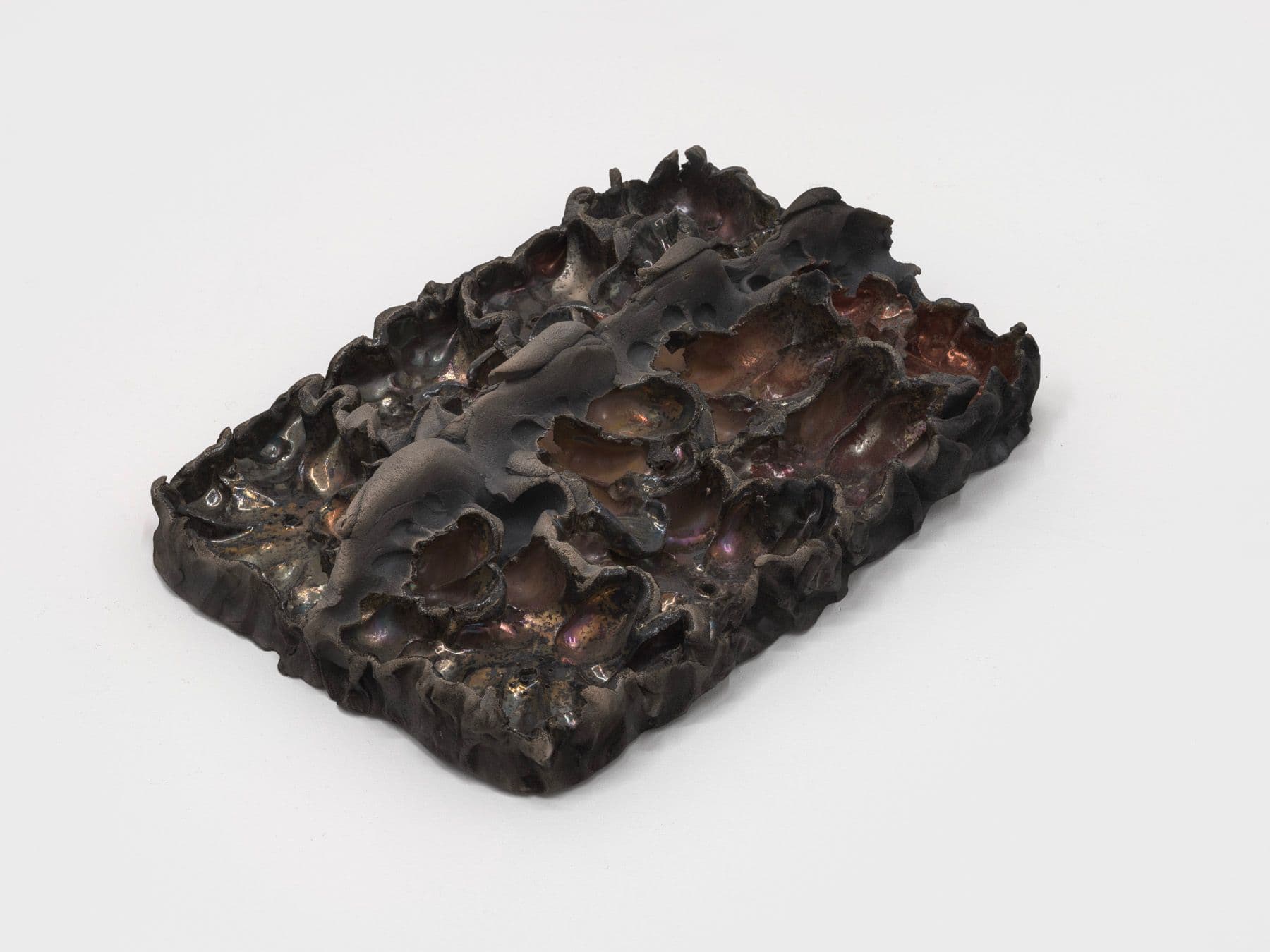Lizette Hernández. Caricias, 2023. Raku fired 
 earthenware. 12 x 8.5 x 3 inches.