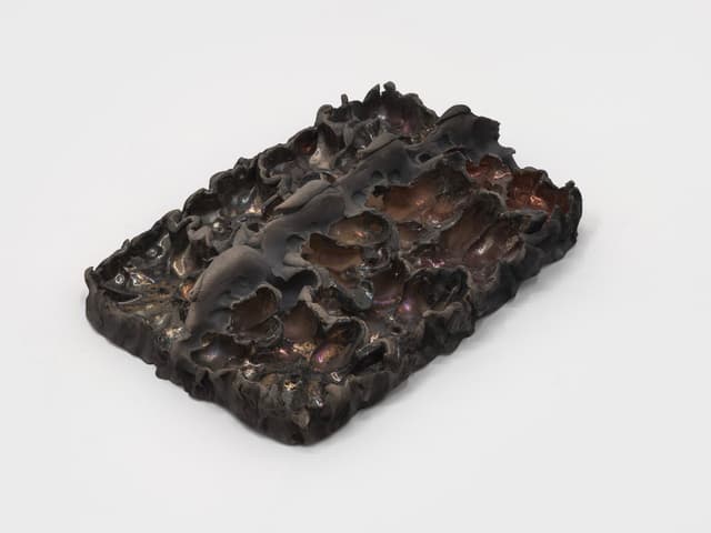 Lizette Hernández. Caricias, 2023. Raku fired 
 earthenware. 12 x 8.5 x 3 inches.