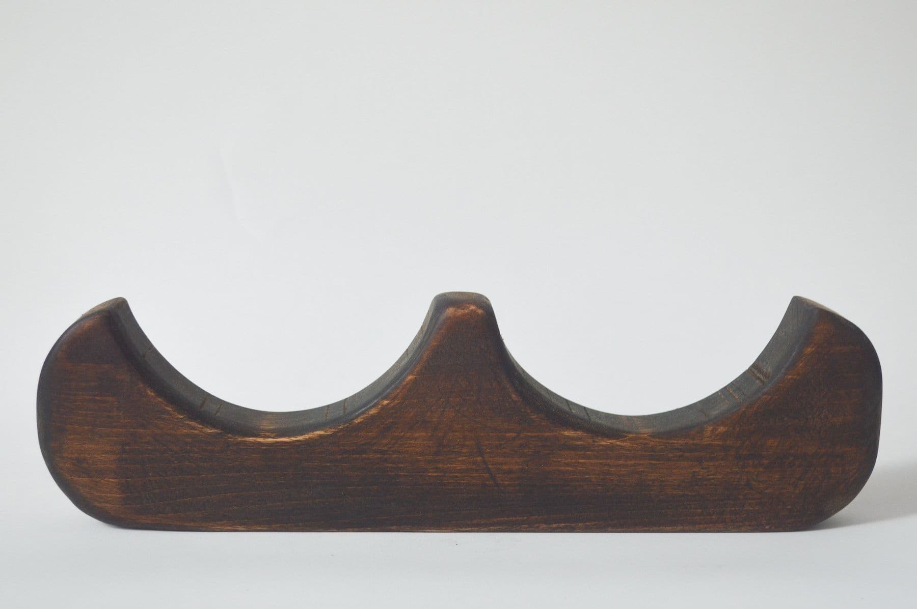 Kai Jenrette. <i>and (32/50)</i>, 2023. Basswood. 3.5 × 12.75 × 1.25 inches.