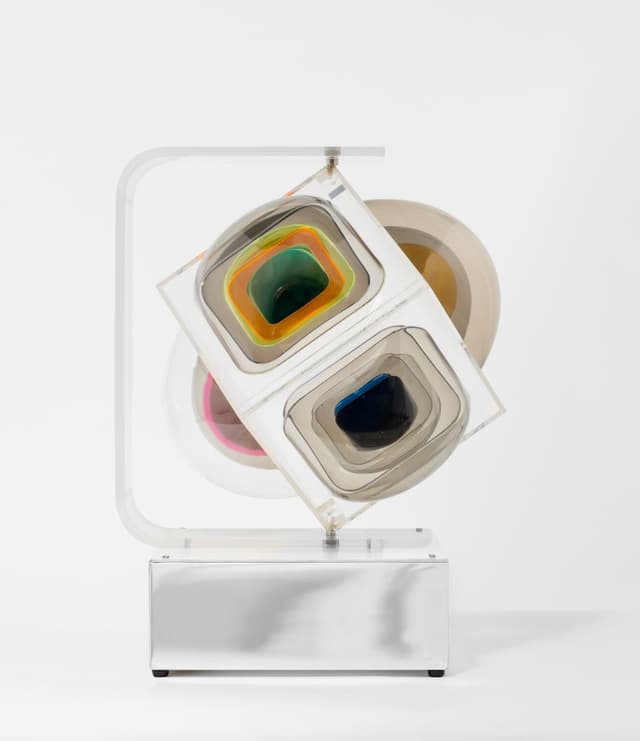 Aaronel deRoy Gruber. Permutation I, 1974. Vacuum-formed tinted and translucent Plexiglas, metal, chrome-plated steel, 1-rpm motor, and light. 20 x 15 x 15 inches.