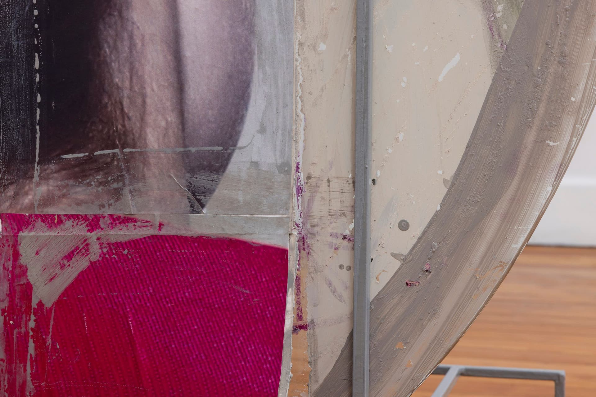 Marisa Kriangwiwat Holmes. Heads - Coin (Detail), 2024. Tiled inkjet glossy prints, oil pastel, rice and wheat paste on found glass, iron. 40 × 48 × 27 inches.