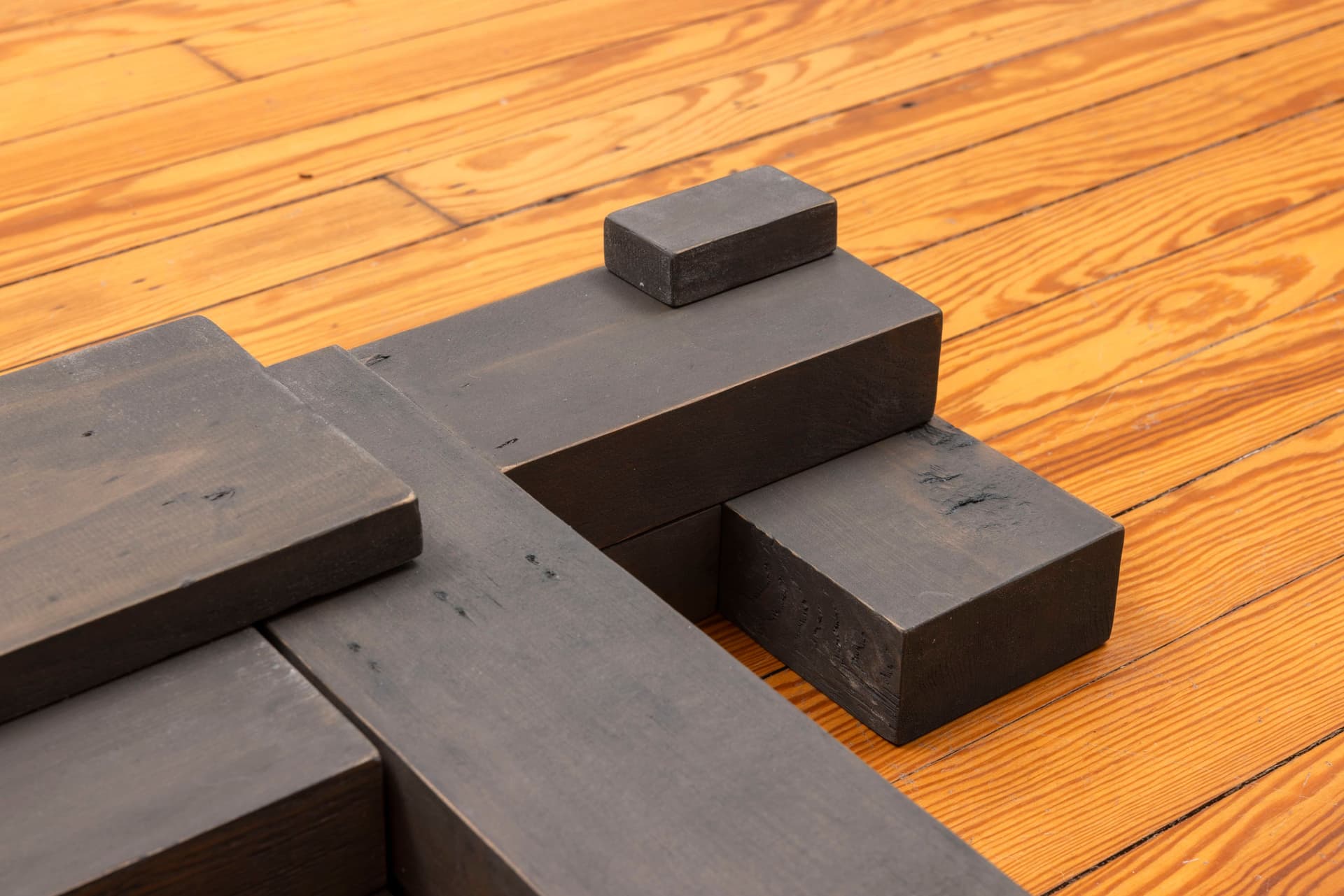 Lai Yu Tong. Dog (Greywash) (Detail), 2025. Emulsion paint on pine wood. 4 3/4 × 31 1/2 × 23 1/2 inches. Courtesy the artist and ShanghART, Singapore.