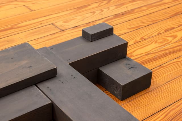 Lai Yu Tong. Dog (Greywash) (Detail), 2025. Emulsion paint on pine wood. 4 3/4 × 31 1/2 × 23 1/2 inches. Courtesy the artist and ShanghART, Singapore.