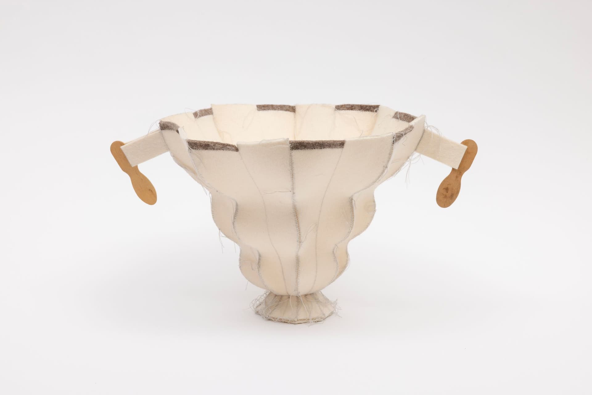 Cyrilla Mozenter. More saints seen 29, 2005. Pencil on industrial wool felt hand stitched with silk thread and wooden ice cream spoons. 8.5 × 15.5 × 10.75 inches.