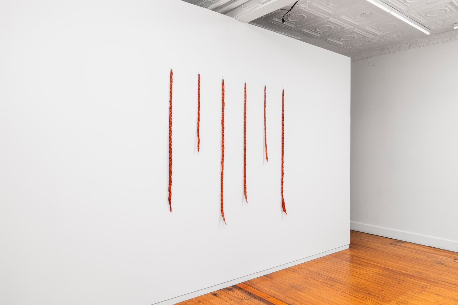 Faye HeavyShield. gravity & ascension, 2026. Acrylic and gesso on paper, wire. 60 × 61 1/2 inches. Dimensions variable.