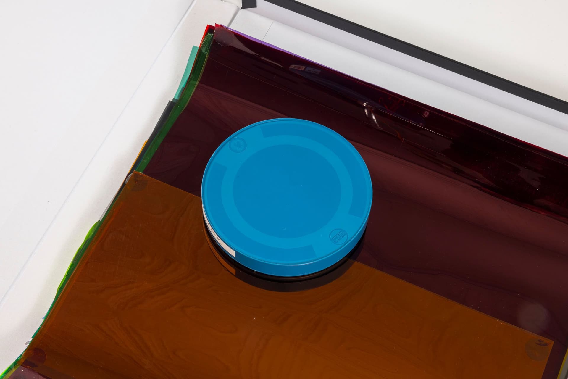 Margaret Honda. Retired Work (Detail), 2021-2023. Film (Fluentum), 2021, 36 Rosco and Lee lighting gels, 4-page score; Wildflowers (NG), 2015, color composite 16mm film print, 100 feet on core in can; Film (Basel Social Club), 2023, 236 Polyester gels, 5-page score. 2.375 × 24.875 × 43.375 inches. Courtest of the artist and Galerie Molitor, Berlin.