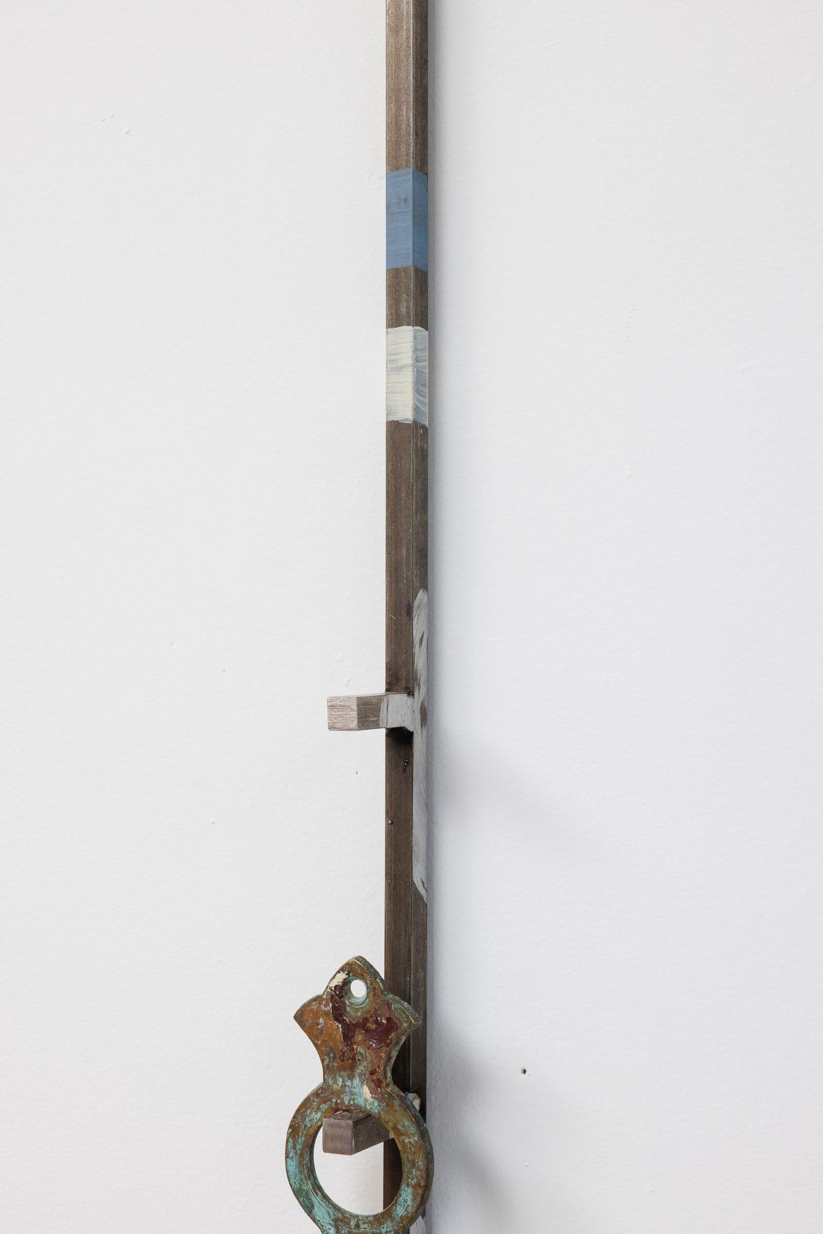 Marisa Kriangwiwat Holmes. Staff (Detail), 2024. Iron, ceramic, keys, metal locks, enamel paint, hand-dyed fabric. 77 × 5.5 inches.
