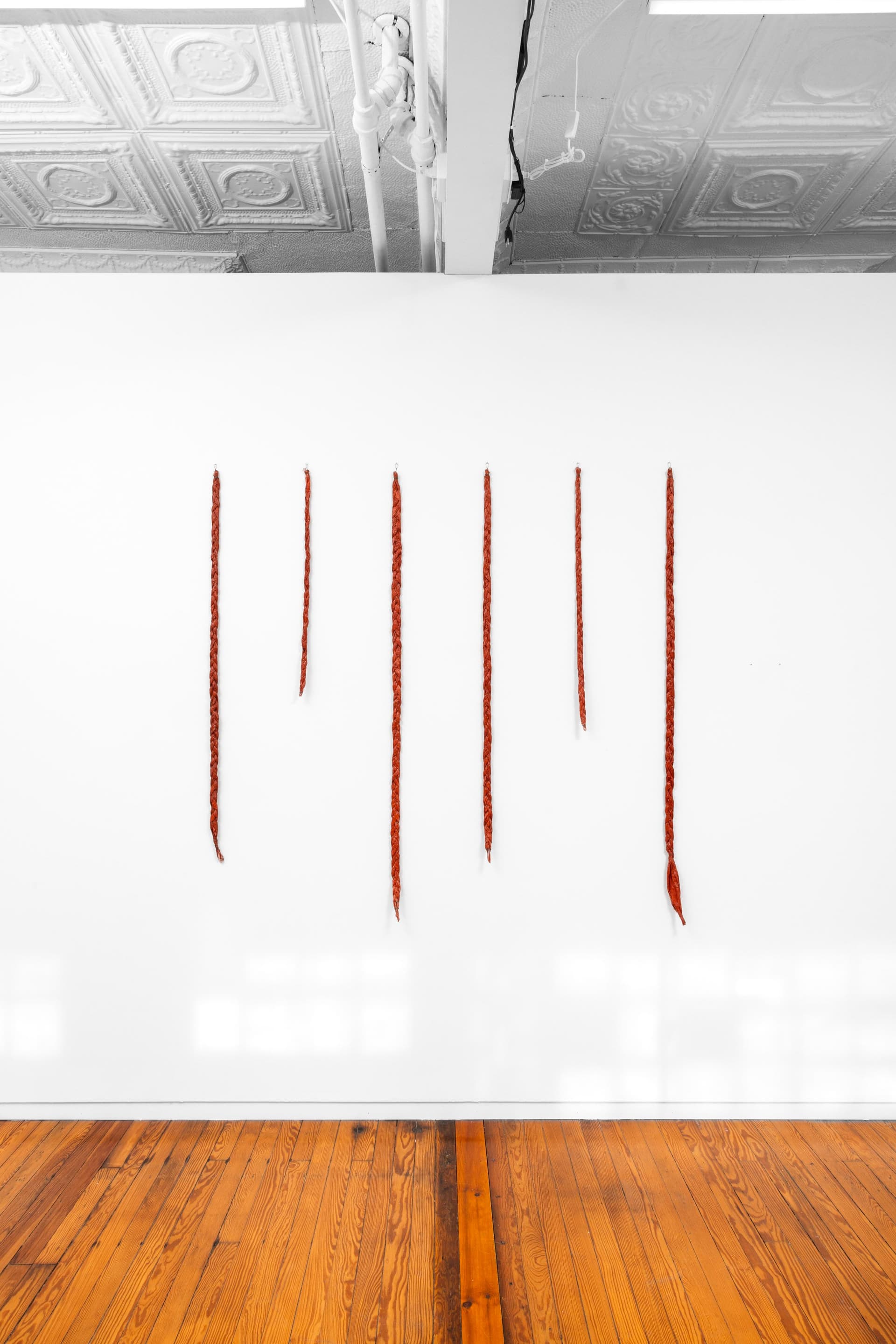 Faye HeavyShield. gravity & ascension, 2026. Acrylic and gesso on paper, wire. 60 × 61 1/2 inches. Dimensions variable.