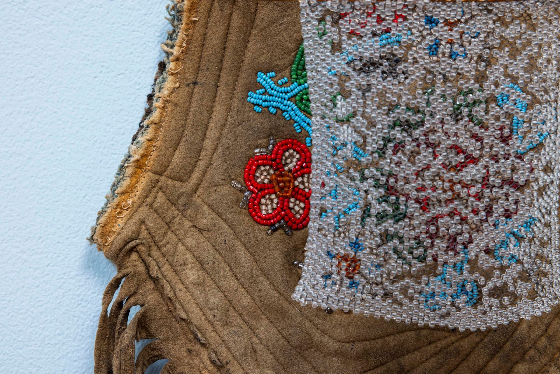 Audie Murray. Detail of <i>Net Charm; <</i>, 2025. Glass beads, thread, copper, reutilized beadwork from an unknown artist. 13 × 8 × 3 inches.