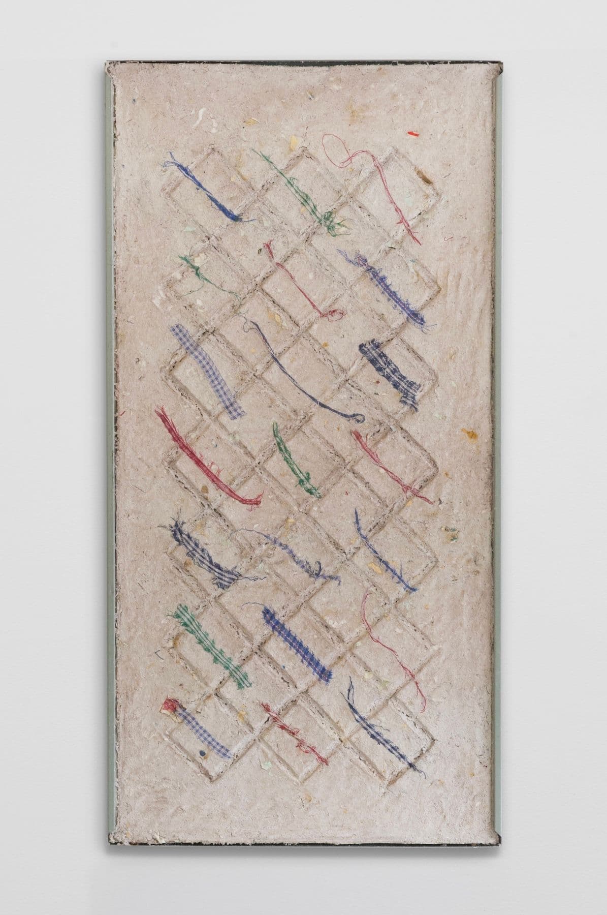 Bronson Smillie. <i>Debris Flow Wall Panel I</i>, 2026. Paper pulp, bar rag, postage stamps, metal shelf. 48 × 24 inches.