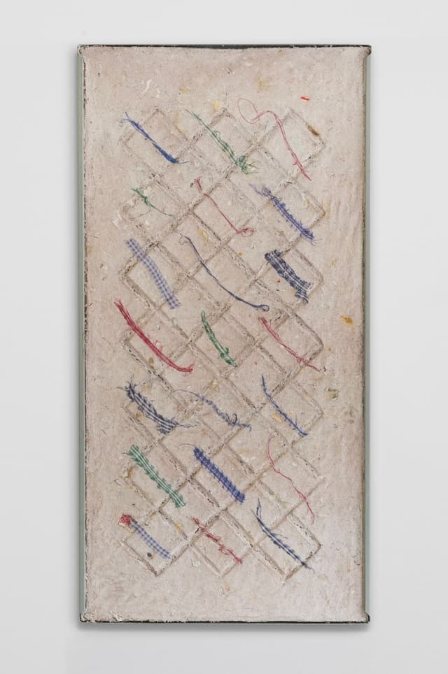 Bronson Smillie. <i>Debris Flow Wall Panel I</i>, 2026. Paper pulp, bar rag, postage stamps, metal shelf. 48 × 24 inches.
