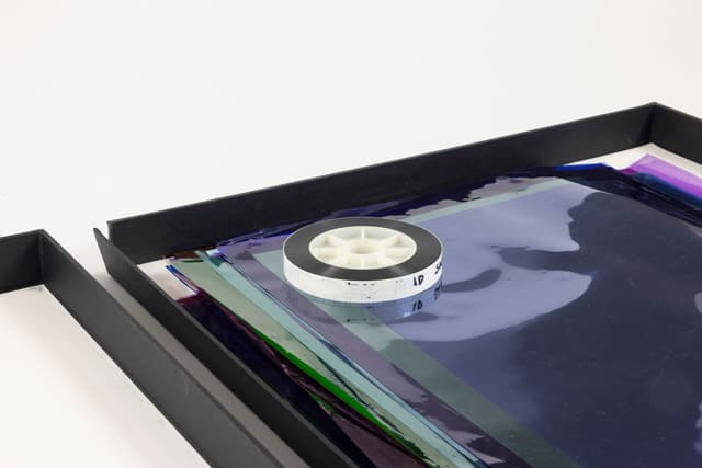 Margaret Honda. Retired Work (Detail), 2016-2017. Wildflowers (NG), 2015, color composite 16mm film print, 100 feet on core; Film (Visitor Welcome Center), 2017, 90 Rosco and Lee lighting gels, 2-page score; Film (SpazioA), 2017, 33 Rosco CalColor gels, 1-page score; Film (FAHRBEREITSCHAFT), 2017, 33 Rosco CalColor gels, 2-page score. 2 × 21.75 × 42.75 inches. Courtesy of the artist and Galerie Molitor, Berlin.