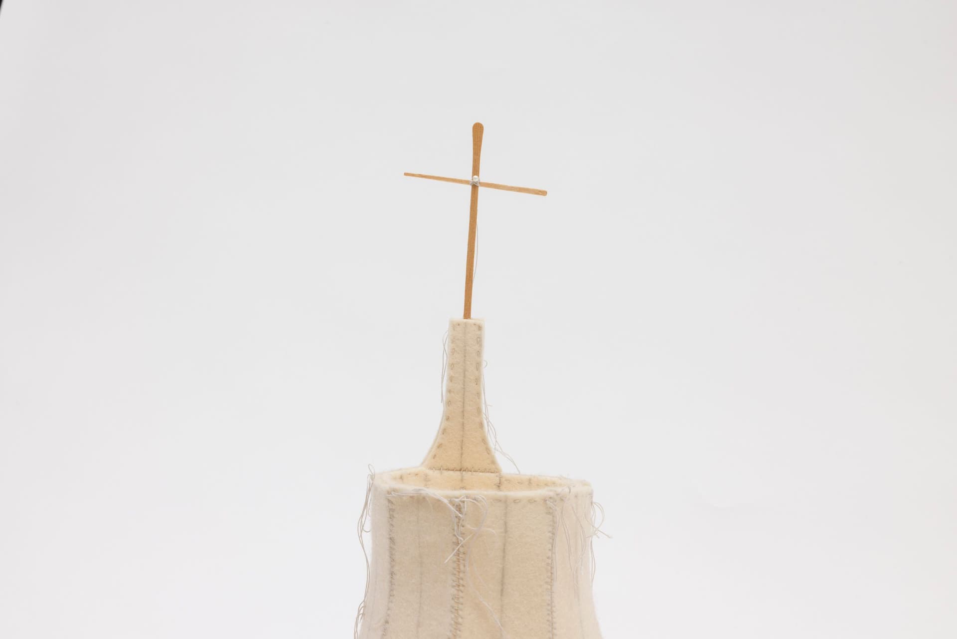 Cyrilla Mozenter. More saints seen 18 (Detail), 2004. Pencil on industrial wool felt hand stitched with silk thread, wooden craft stick and toothpick, button, pearls, and bugle beads. 13.5 × 16 × 16 inches.