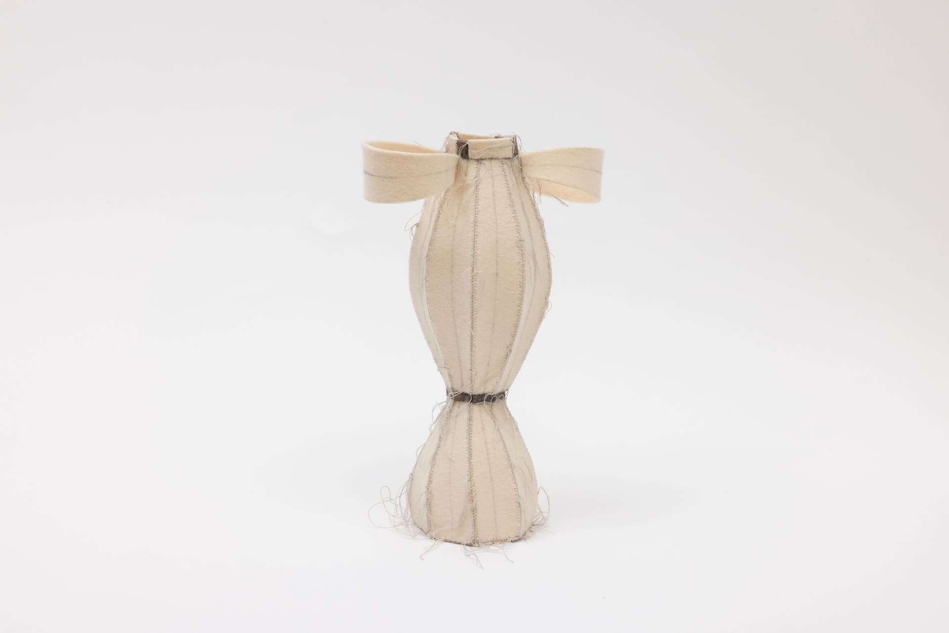 Cyrilla Mozenter. More saints seen 10, 2004. Pencil on industrial wool felt hand stitched with silk thread. 11 × 7 × 4 inches.