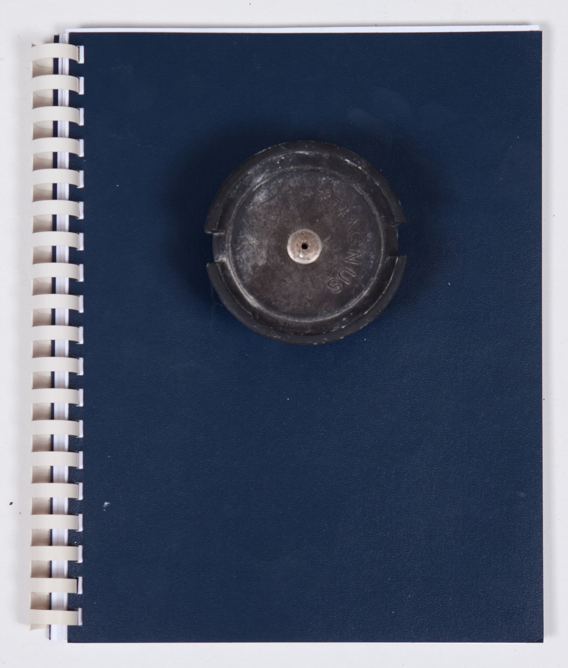 Mo Costello. Untitled (Reader), 2023. Ongoing circulation of 'Readers', made up of combination of text and image-based reproductions and found materials. Circulated locally in Jackson, Clarke and Fulton county (GA) among a circuit of convenience stores, gas stations and pharmacies as well as the flea market where Costello has maintained a working studio for the last several years. Xerox Reader: Xerox Text; Xerox Images; Toner; Ink; Gelatin Silver Contact Prints; Exposed Ortho Film (Kodalith Type III); Comb-binding; Foil Tape; Self-Inking Stamp (J & J Library, Building Three, Unit 27); Stamp from Found Object (ROTC Recalled Footwear from J & J Flea Market); Found Magnus Speaker (J & J Flea Market). 11 x 9 x 4 inches (Closed).