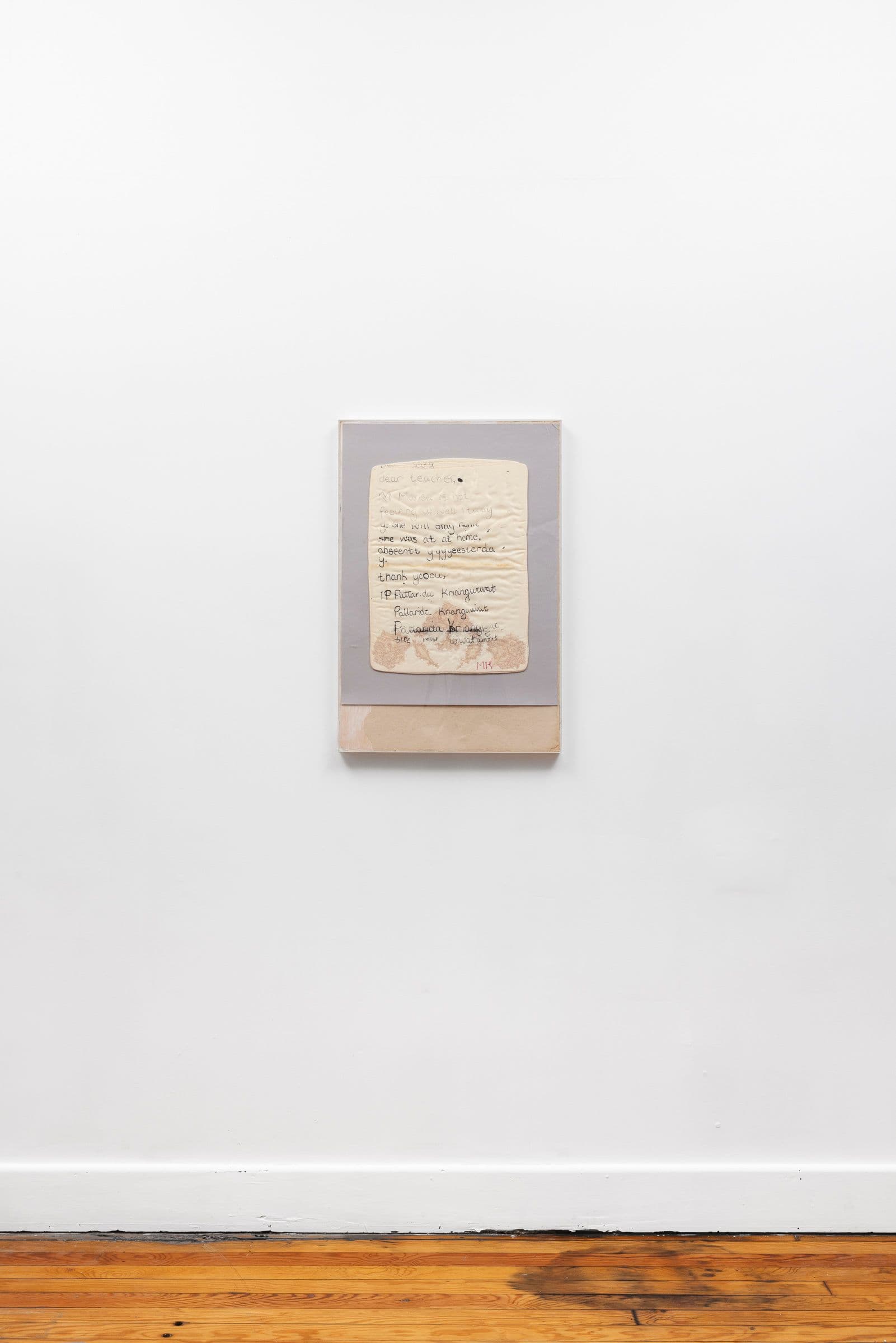 Marisa Kriangwiwat Holmes. Sick Note, 2024. Silkscreen on silk and lace pillow, hand-colored card stock, acrylic frame. 30.25 × 20.5 inches.