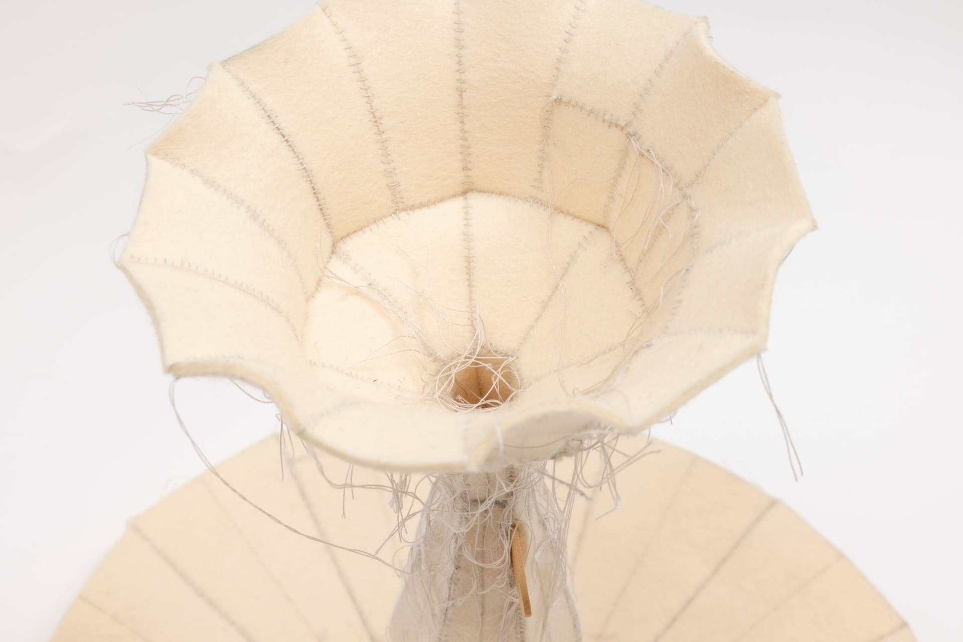 Cyrilla Mozenter. More saints seen 30 (Detail), 2005. Pencil on industrial wool felt hand stitched with silk thread and wooden ice cream spoon. 12.75 × 13 × 13 inches.