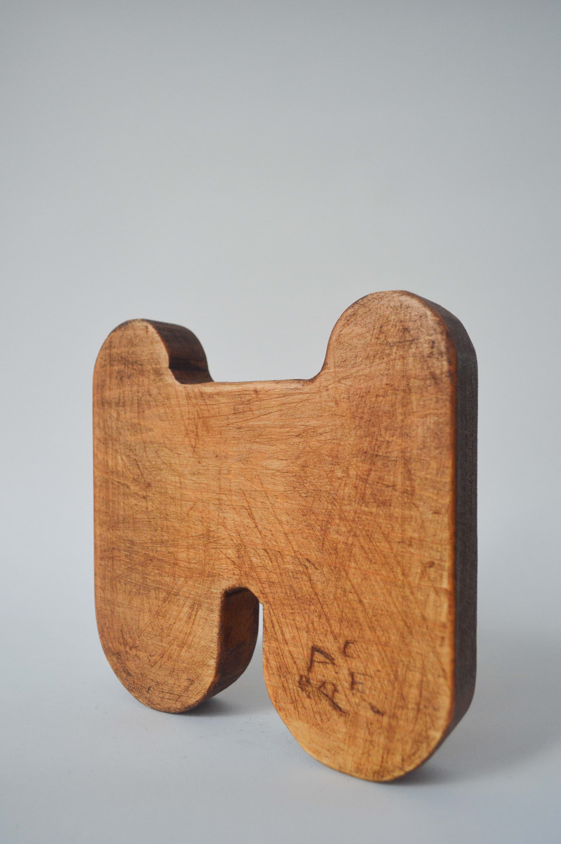 Kai Jenrette. and (23/50), 2023. Basswood. 7 × 7 × 1 inches.