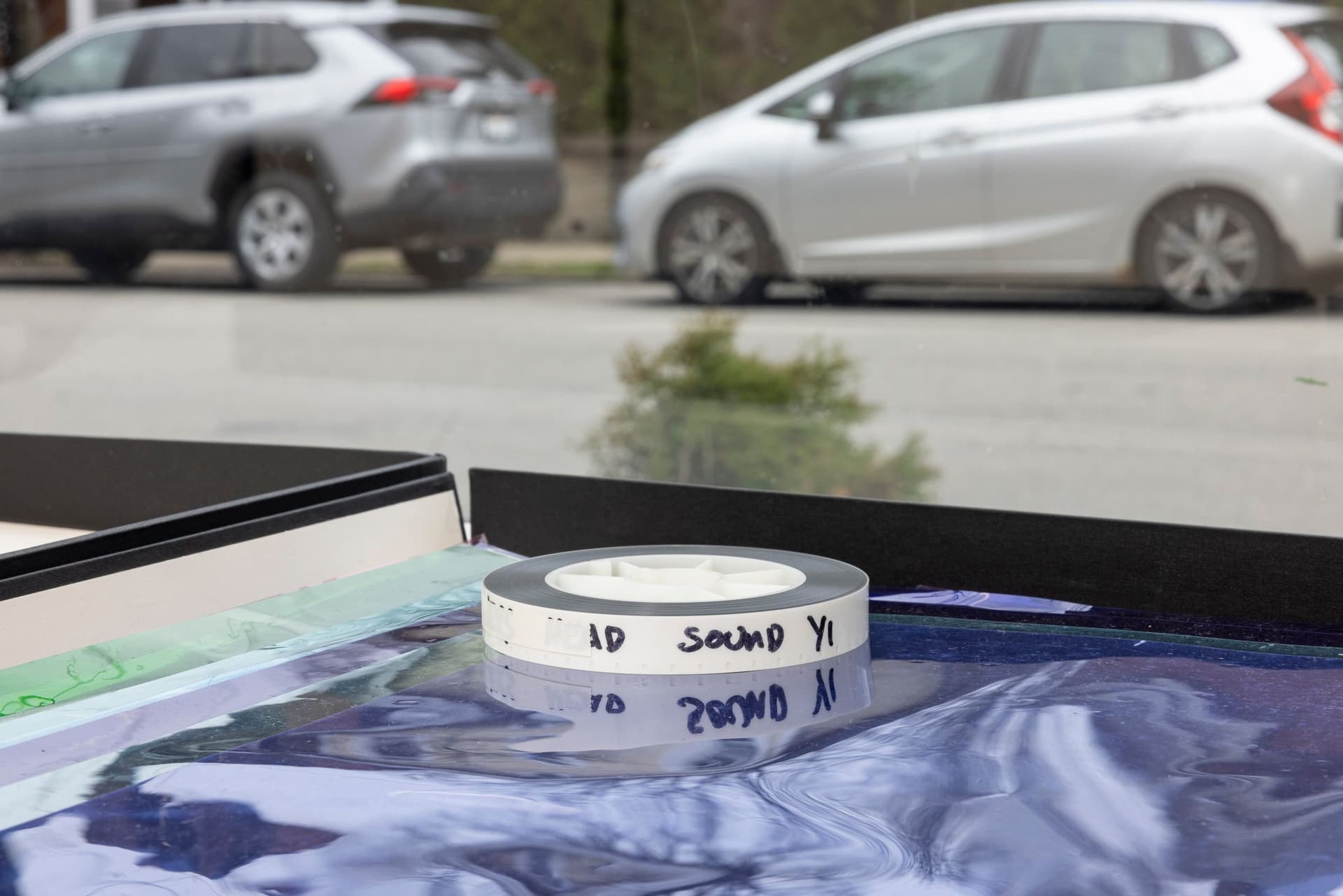 Margaret Honda. Retired Work (Detail), 2016-2017. Wildflowers (NG), 2015, color composite 16mm film print, 100 feet on core; Film (Visitor Welcome Center), 2017, 90 Rosco and Lee lighting gels, 2-page score; Film (SpazioA), 2017, 33 Rosco CalColor gels, 1-page score; Film (FAHRBEREITSCHAFT), 2017, 33 Rosco CalColor gels, 2-page score. 2 × 21.75 × 42.75 inches. Courtesy of the artist and Galerie Molitor, Berlin.