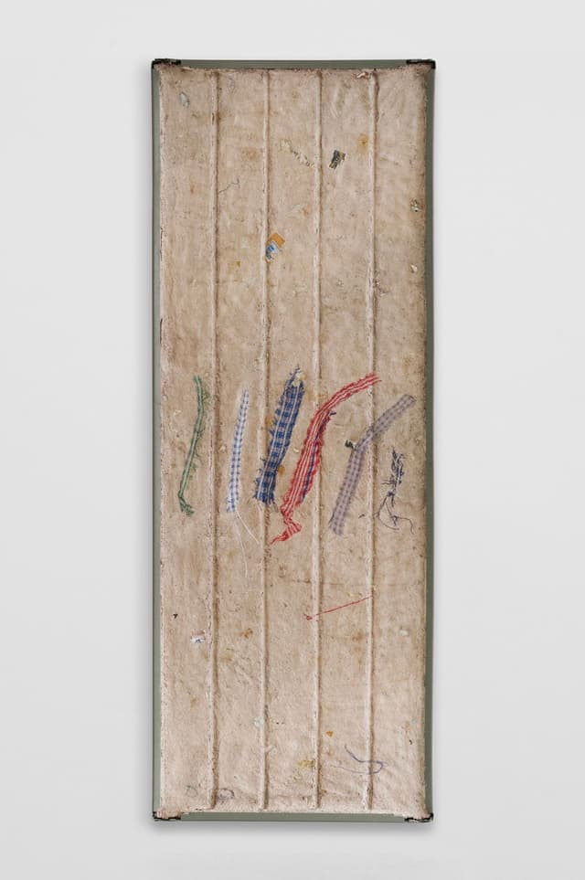 Bronson Smillie. <i>Debris Flow Wall Panel III</i>, 2026. Paper pulp, bar rag, postage stamps, metal shelf. 48 × 18 inches.