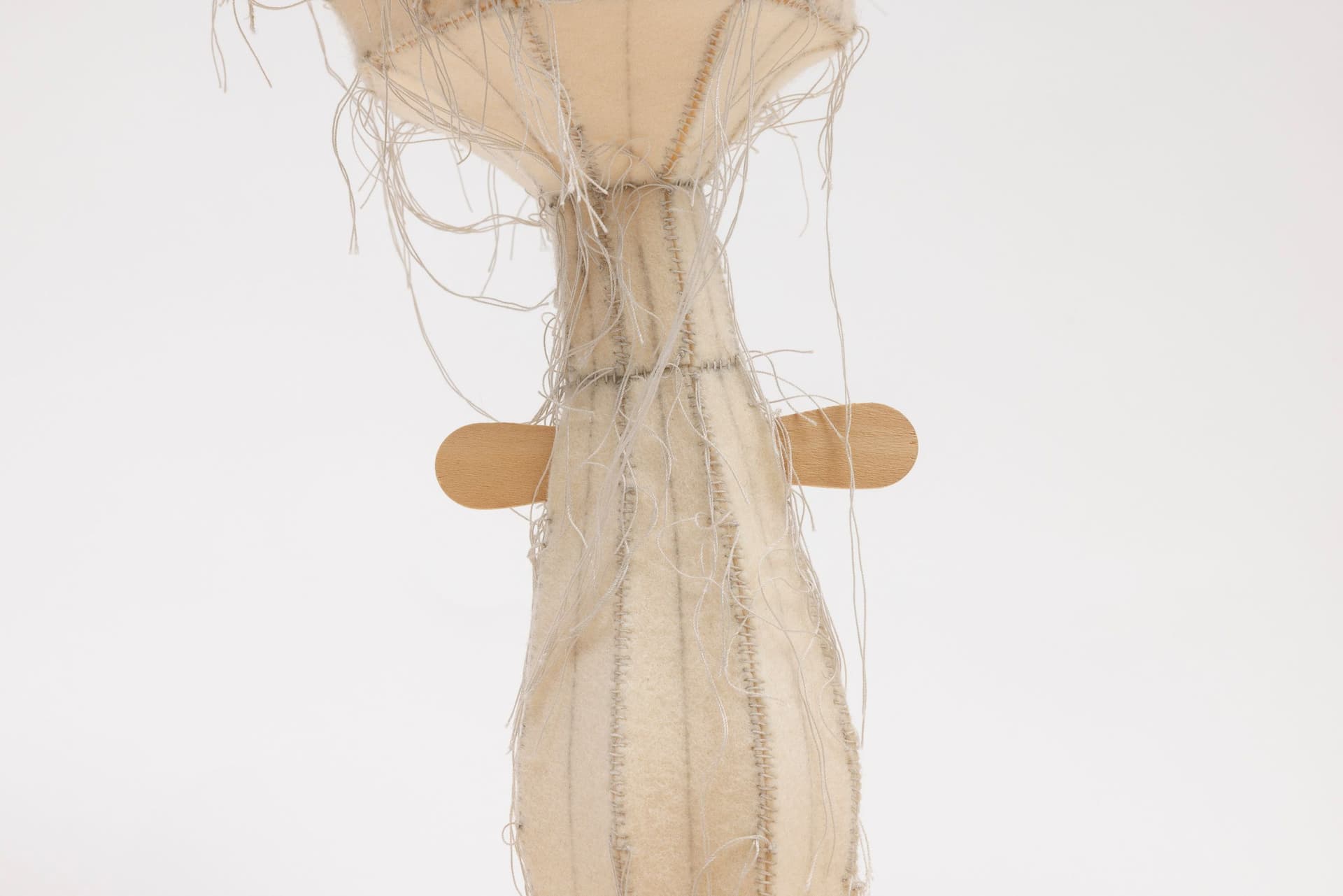 Cyrilla Mozenter. More saints seen 30 (Detail), 2005. Pencil on industrial wool felt hand stitched with silk thread and wooden ice cream spoon. 12.75 × 13 × 13 inches.