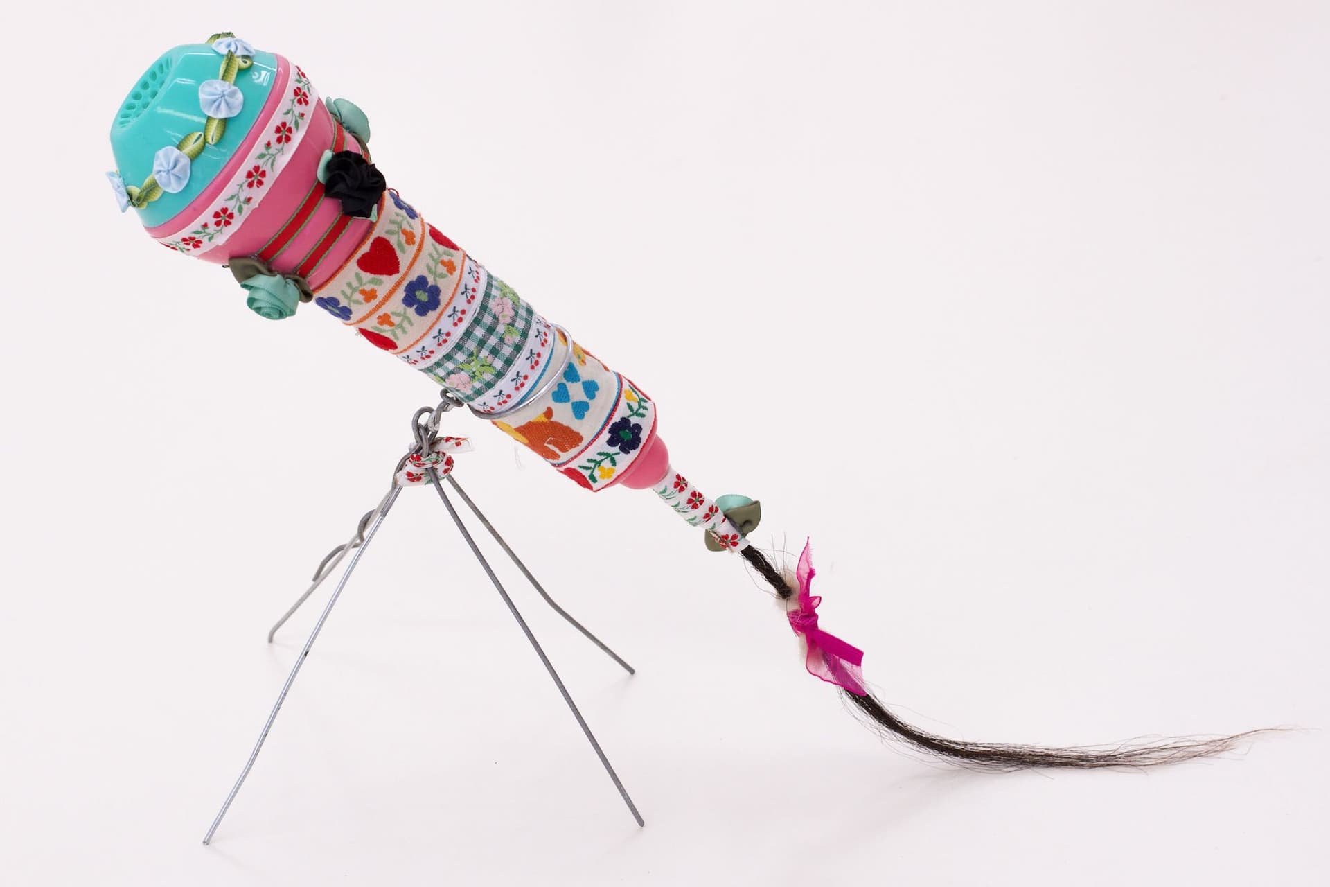 Alix Van Der Donckt-Ferrand. Untitled, 2023. Plastic microphone, ribbons, glue, horse hair, dog hair, wire. 11 x 13 x 6 inches.