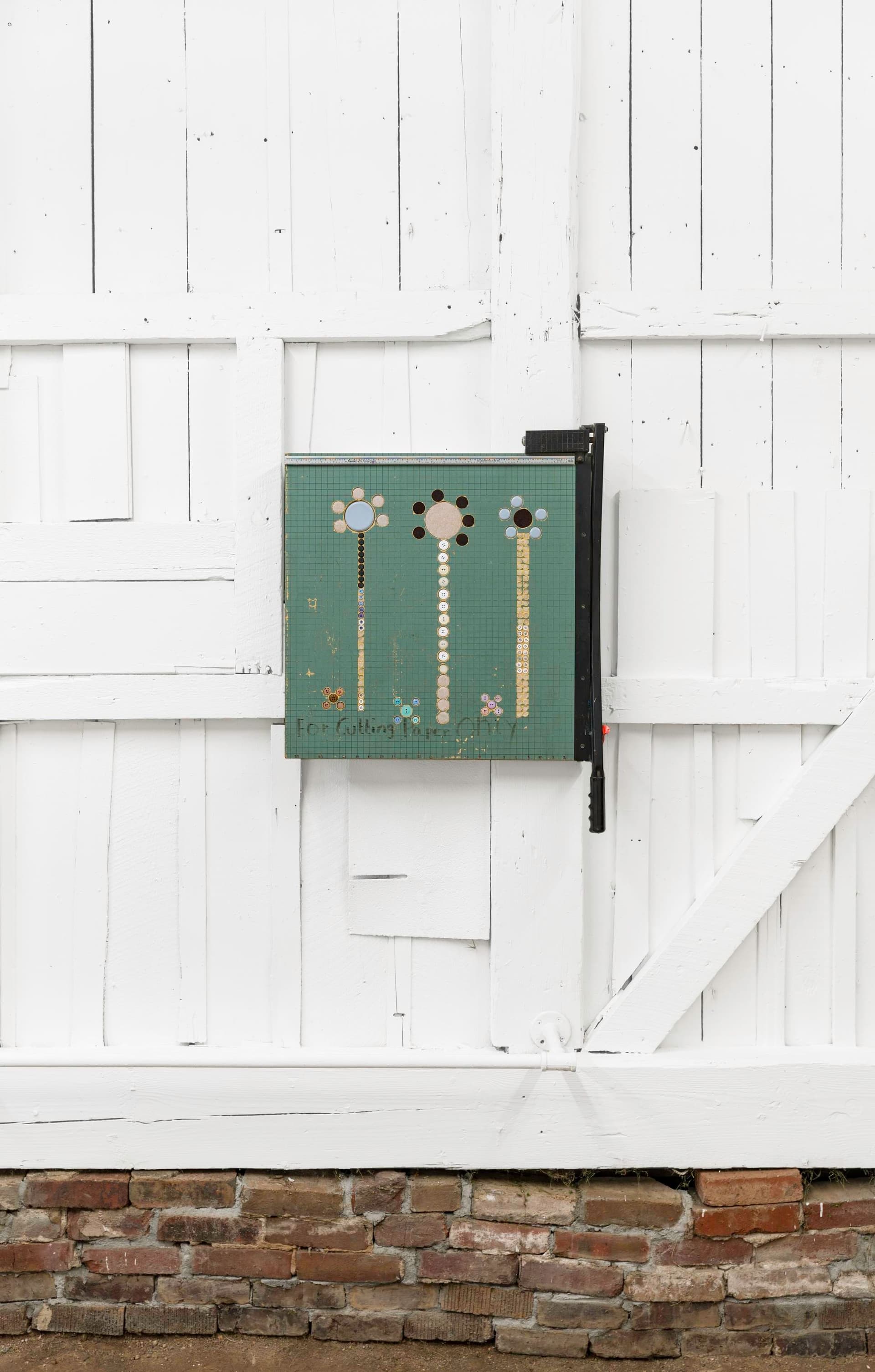 Bronson Smillie. Paper Guillotine 1, 2024. Paper guillotine, felt pads, buttons.
