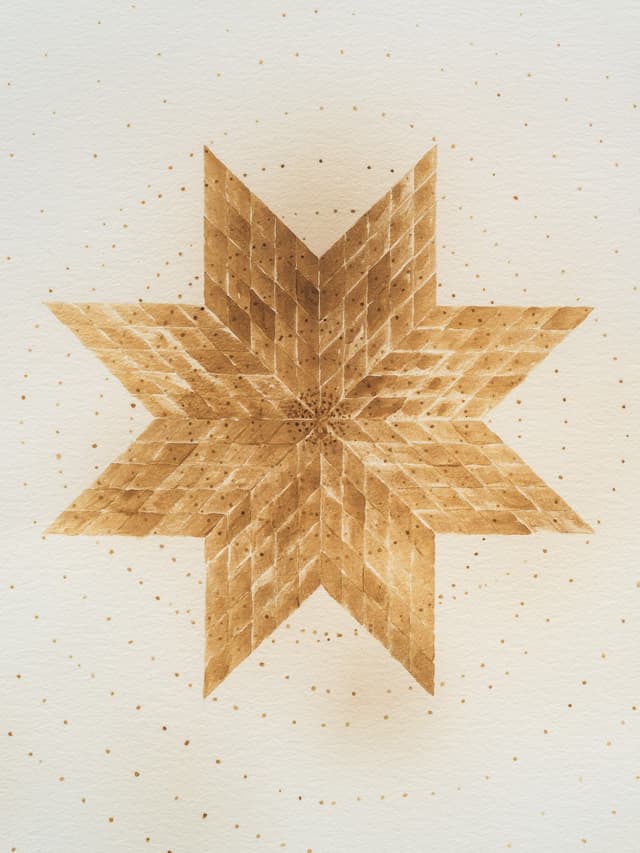 Audie Murray. Detail of <i>Gold Thread</i>, 2026. Artist's breast milk and heat on paper. 23.75 × 18 inches (26 ¾ × 21 inches framed).